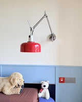 Iron & Glass craftsmanship detail on Rosso Swing Arm Curated Iron & Glass Wall Sconce