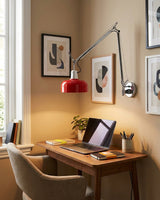 Rosso Swing Arm Curated Iron & Glass Wall Sconce installed in residential dining space
