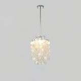 Round Shell Curated Iron & Glass Chandelier – illuminated warm ambiance setting #1
