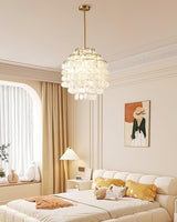 Round Shell Curated Iron & Glass Chandelier – illuminated warm ambiance setting