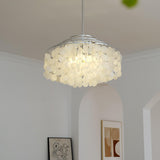 Round Shell Curated Iron & Glass Chandelier warm illuminated room view