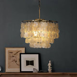 Round Shell Curated Iron & Glass Chandelier installed in residential dining space