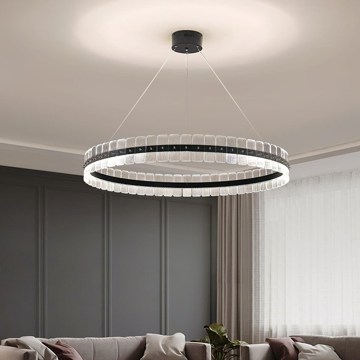 Saturno LED Curated Optical Acrylic Chandelier warm illuminated room view