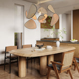 Screen Cannage Curated Woven Rattan Chandelier installed in residential dining space