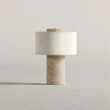 Sediment Curated Yellow Travertine Table Lamp – illuminated warm ambiance setting
