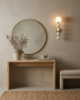 Selene Gourd Alabaster Curated Alabaster Wall Sc – illuminated warm ambiance setting