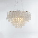 Shell Wind Chime Curated Iron & Glass Chandelier – illuminated warm ambiance setting #1
