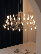 Sky Ballet Curated Optical Acrylic Chandelier warm illuminated room view