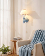 Skylisse Curated Iron & Glass Wall Sconce – illuminated warm ambiance setting