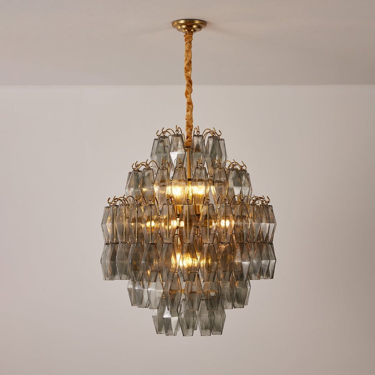 Smoke Gray Prism Round Curated Mouth-Blown Frost installed in residential dining space