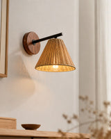 Sovara Rattan Curated Woven Rattan Wall Sconce installed in residential dining space