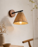 Sovara Rattan Curated Woven Rattan Wall Sconce – illuminated warm ambiance setting