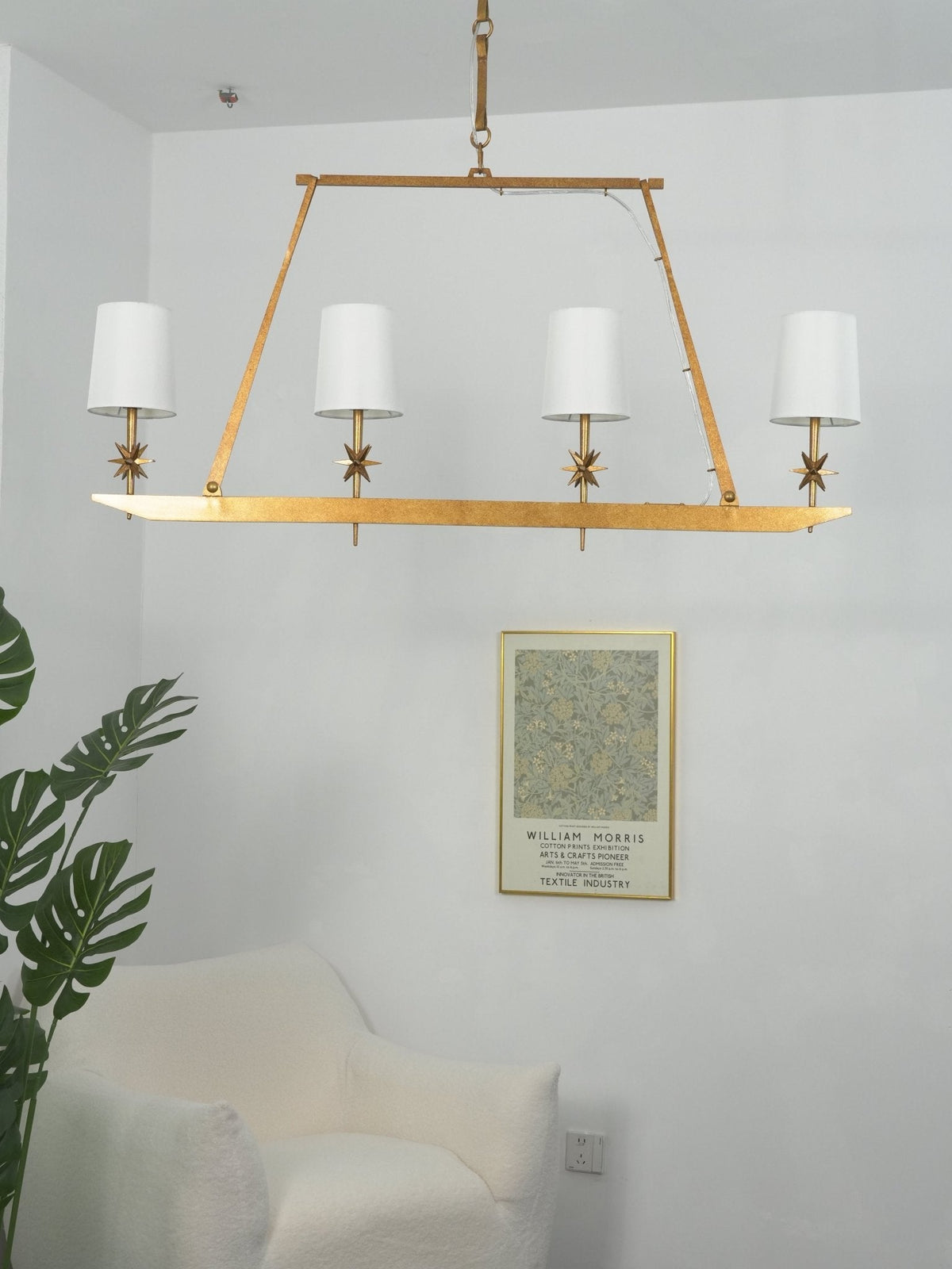 Stellar Frame Linear Curated Solid Brass Chandel – illuminated warm ambiance setting