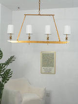Stellar Frame Linear Curated Solid Brass Chandel – illuminated warm ambiance setting