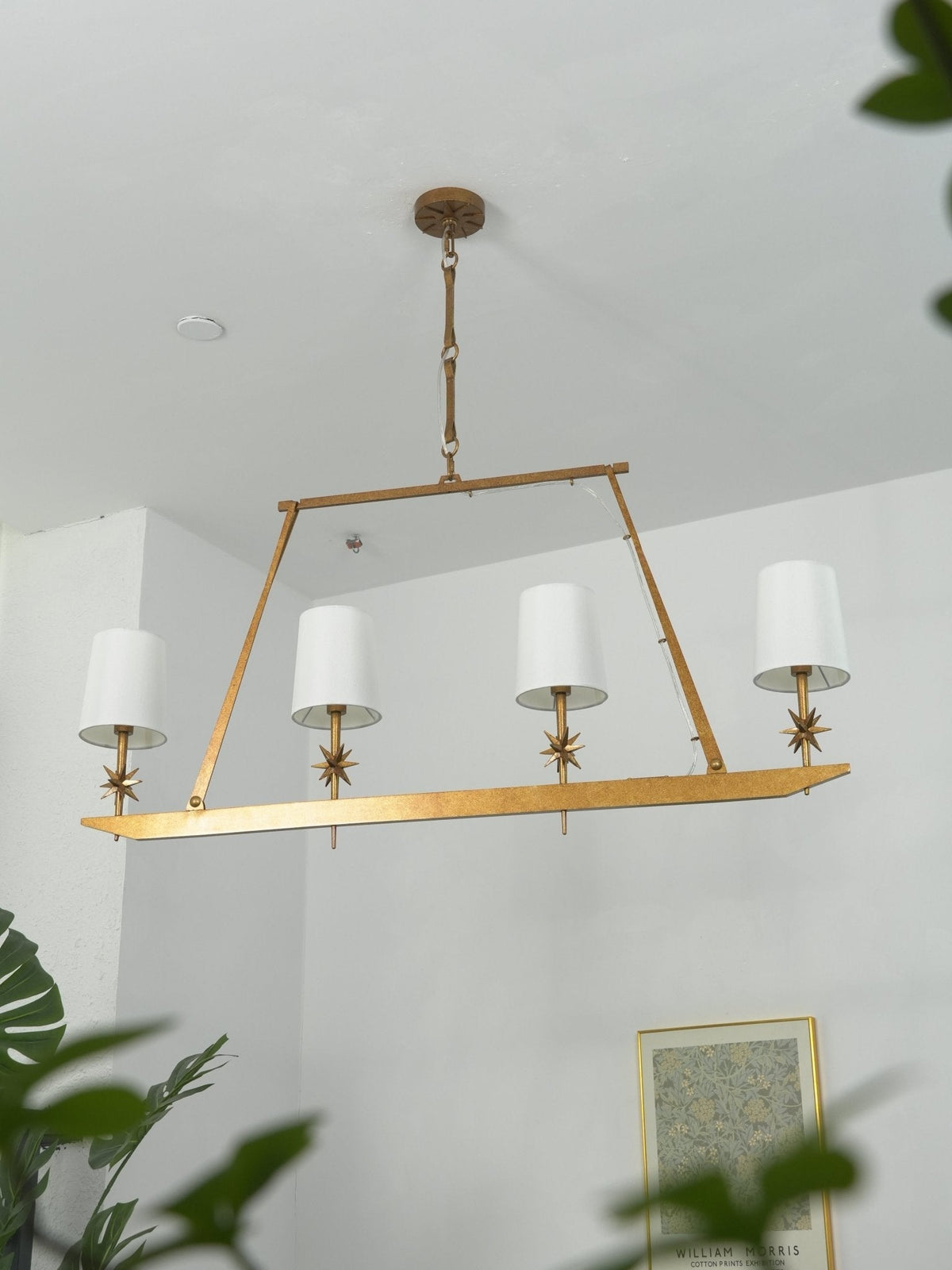Stellar Frame Linear Curated Solid Brass Chandel – spatial dining room perspective
