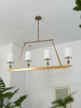 Stellar Frame Linear Curated Solid Brass Chandel – spatial dining room perspective