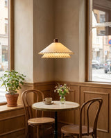 Stitchford Curated Solid Hardwood Pendant Light warm illuminated room view