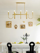 Symphony Curated Iron & Glass Chandelier warm illuminated room view