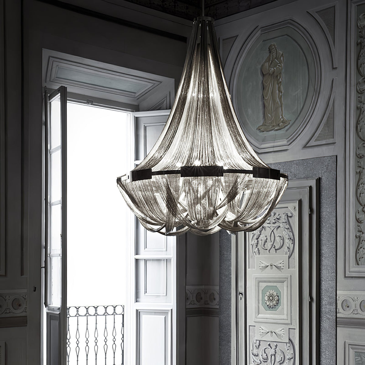 Tassel Aluminum Chain Curated Brushed Nickel Iro installed in residential dining space
