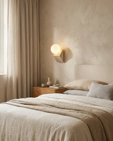 Tavellis Curated Yellow Travertine Wall Sconce warm illuminated room view