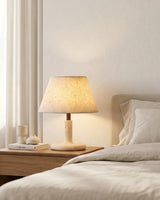Tavien Curated Yellow Travertine Table Lamp warm illuminated room view