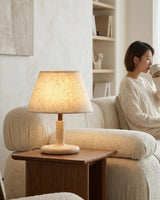 Tavien Curated Yellow Travertine Table Lamp – illuminated warm ambiance setting