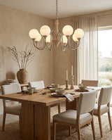 Tavienne Sculptural Travertine Chandelier installed in residential dining space