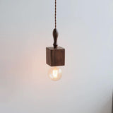 Tavik Curated Solid Hardwood Pendant Light – illuminated warm ambiance setting #1