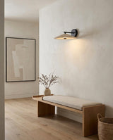Tavric Curated Yellow Travertine Wall Sconce warm illuminated room view