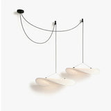 JINSHE Tense Silk Cluster Pendant Light - Angled view in a cozy dining room.