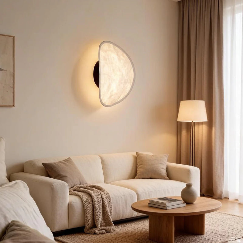 JINSHE Silk & Metal Wall Sconce - Front view capturing the elegant silhouette against a neutral wall in a modern bedroom.