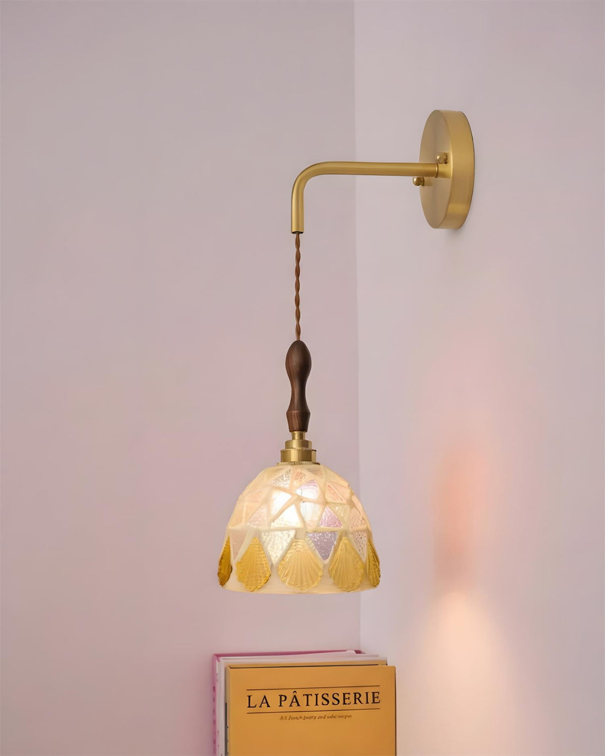 Tessaro Curated Solid Brass Wall Sconce installed in residential dining space