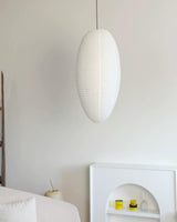 Tomoe Paper Curated Washi Paper Pendant Light warm illuminated room view