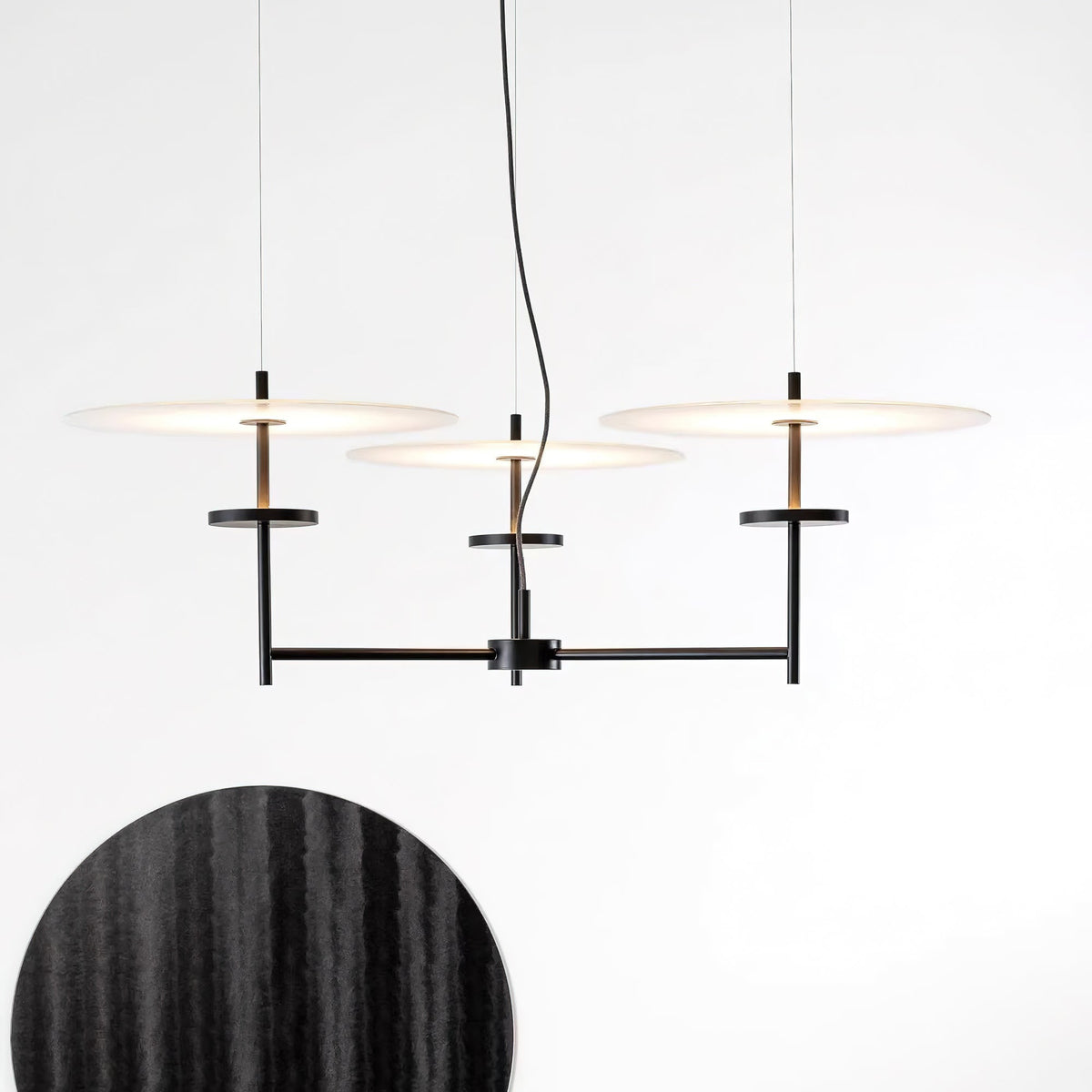 Trezzero Curated Optical Acrylic Chandelier warm illuminated room view