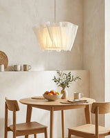 Tullora Curated Iron & Glass Pendant Light warm illuminated room view