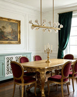 Tuloria Curated Solid Brass Chandelier warm illuminated room view