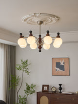 Valerio Curated Mouth-Blown Frosted Glass Chande warm illuminated room view
