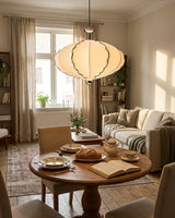 Velmira Curated Iron & Glass Pendant Light warm illuminated room view