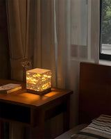 Velto Travertine Curated Yellow Travertine Table – illuminated warm ambiance setting