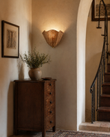 Vera Rattan Curated Woven Rattan Wall Sconce – illuminated warm ambiance setting