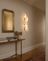 Virelle Alabaster Curated Alabaster Wall Sconce warm illuminated room view