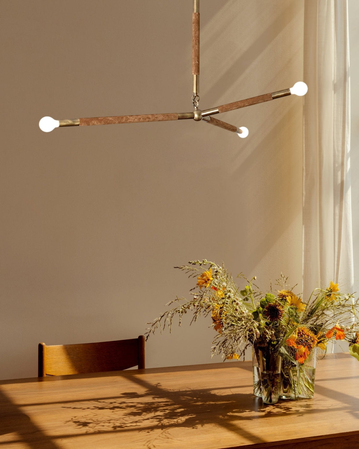 Wrapped Linear Curated Solid Brass Chandelier – full fixture elevation view